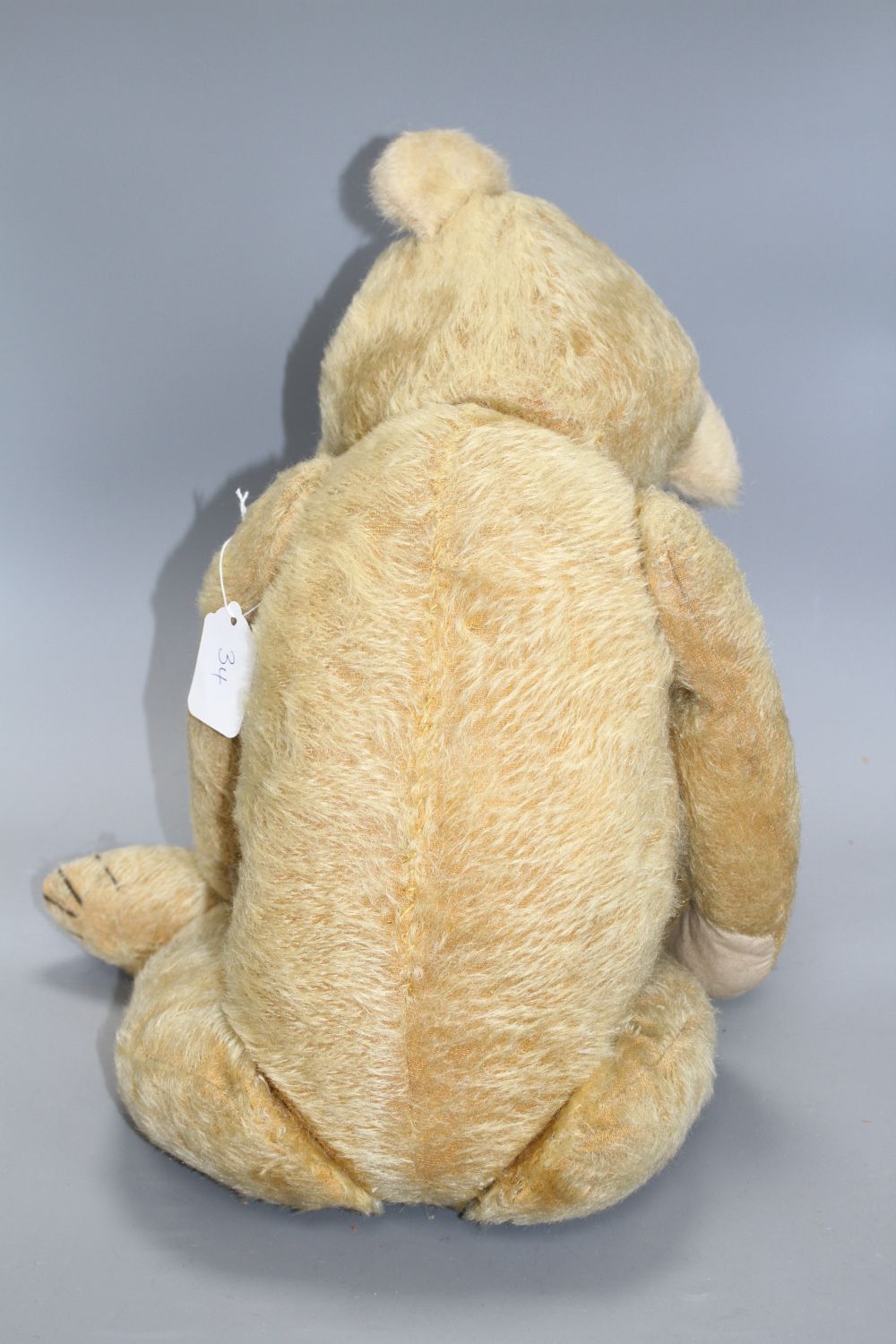 A Chiltern type English bear, c.1930s, 26in., three replaced paw pads, glass eyes